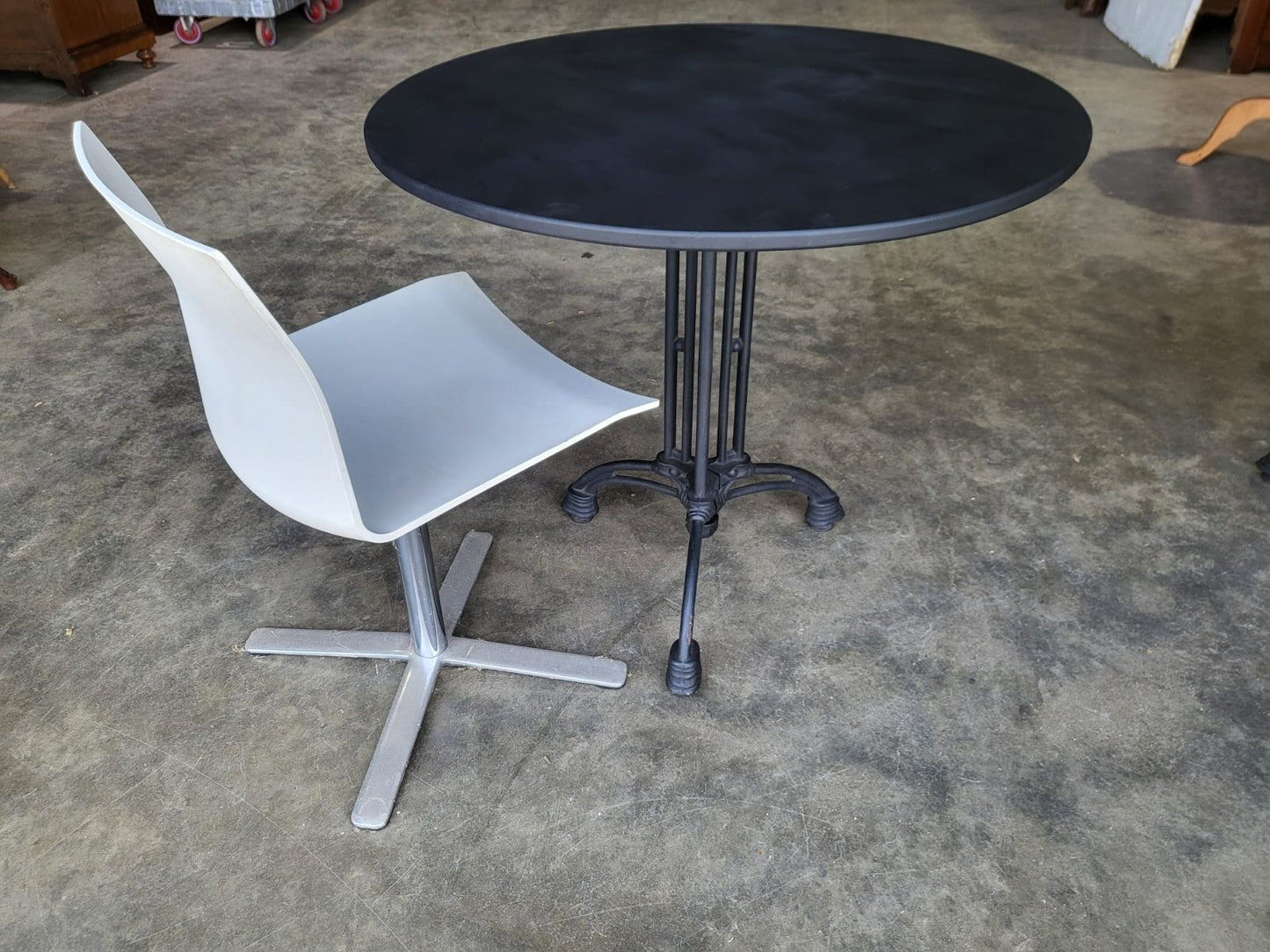 Two black round cast iron bistro dining occasional tables PRICE X 1