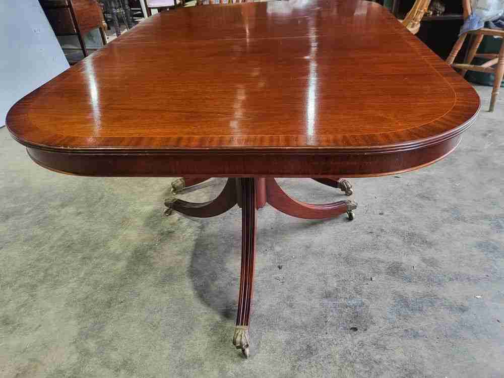 Antique repro mahogany twin pedestal extending D end dining table