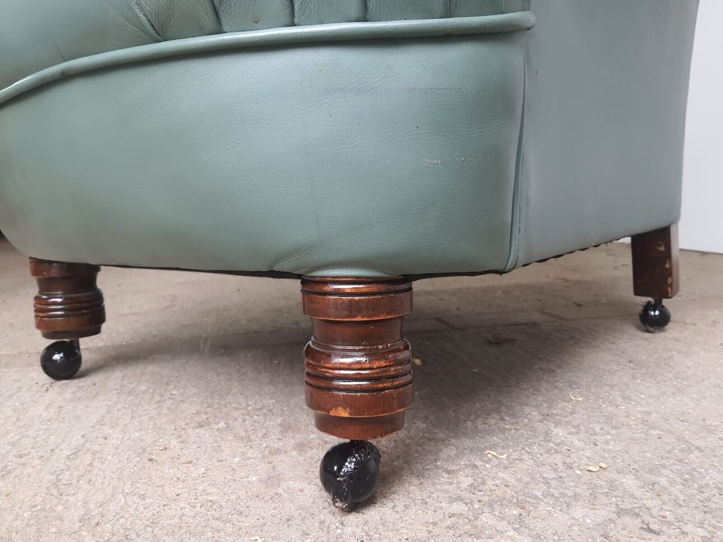 Antique Wing Back Green Leather Armchair Wood Legs Castors