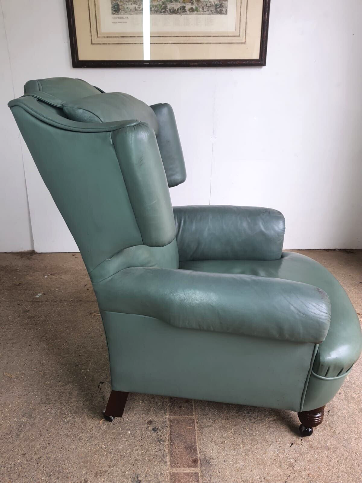 Antique Wing Back Green Leather Armchair Wood Legs Castors