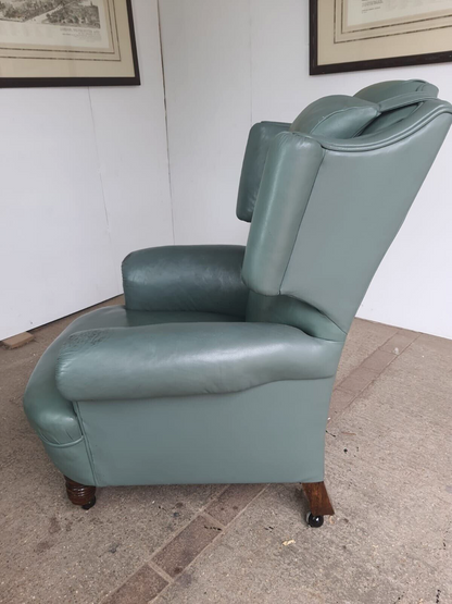 Antique Wing Back Green Leather Armchair Wood Legs Castors