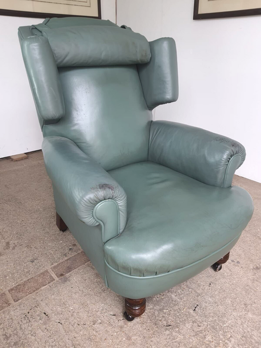 Antique Wing Back Green Leather Armchair Wood Legs Castors