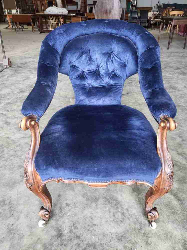 Antique Victorian curved button back blue armchair carved cabriole legs castors