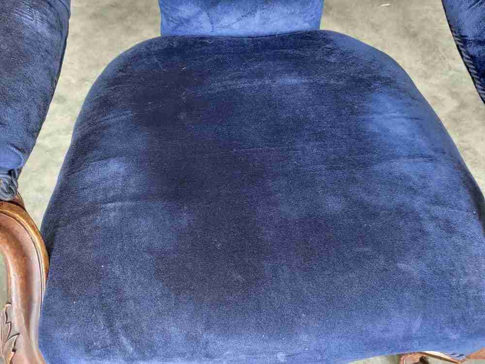 Antique Victorian curved button back blue armchair carved cabriole legs castors