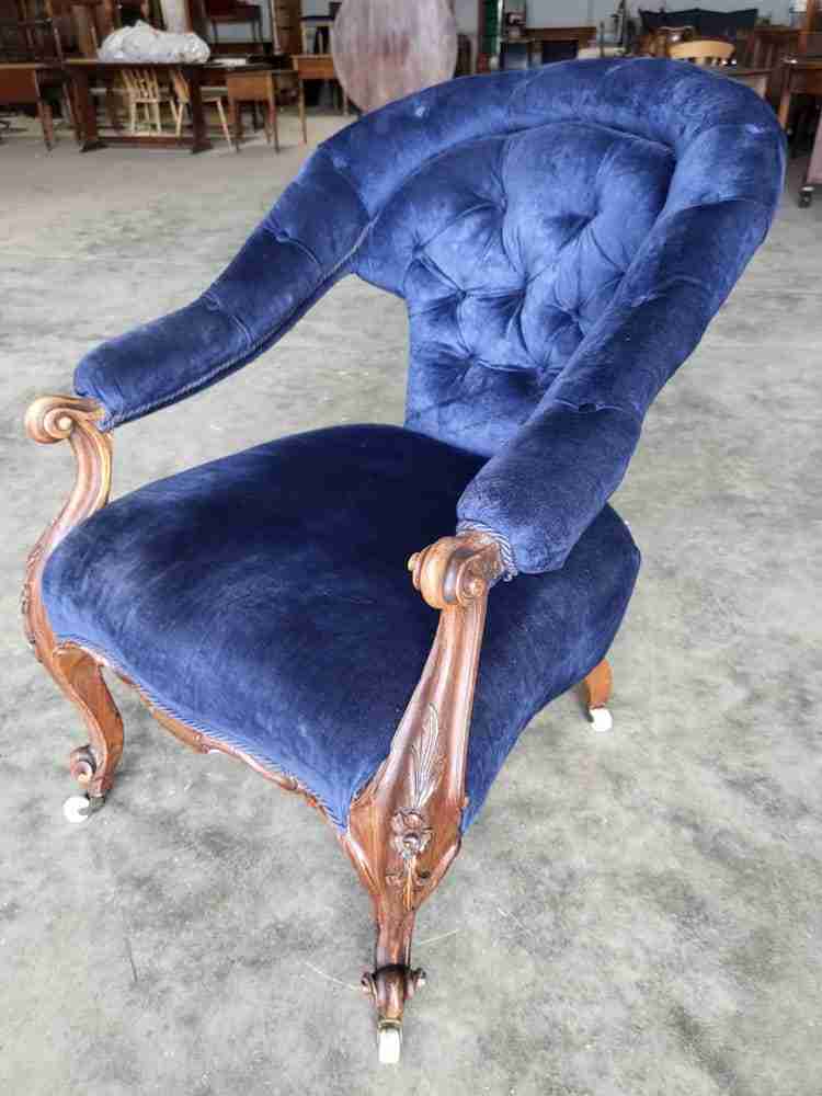 Antique Victorian curved button back blue armchair carved cabriole legs castors