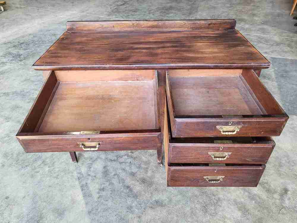 Antique Edwardian single pedestal desk 4 drawers tapered legs castors