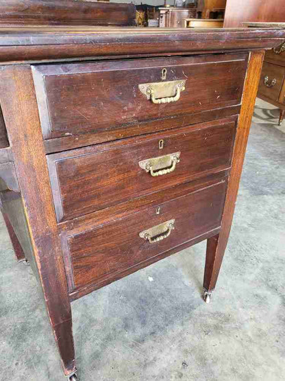 Antique Edwardian single pedestal desk 4 drawers tapered legs castors
