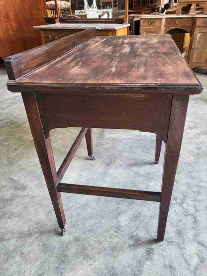 Antique Edwardian single pedestal desk 4 drawers tapered legs castors