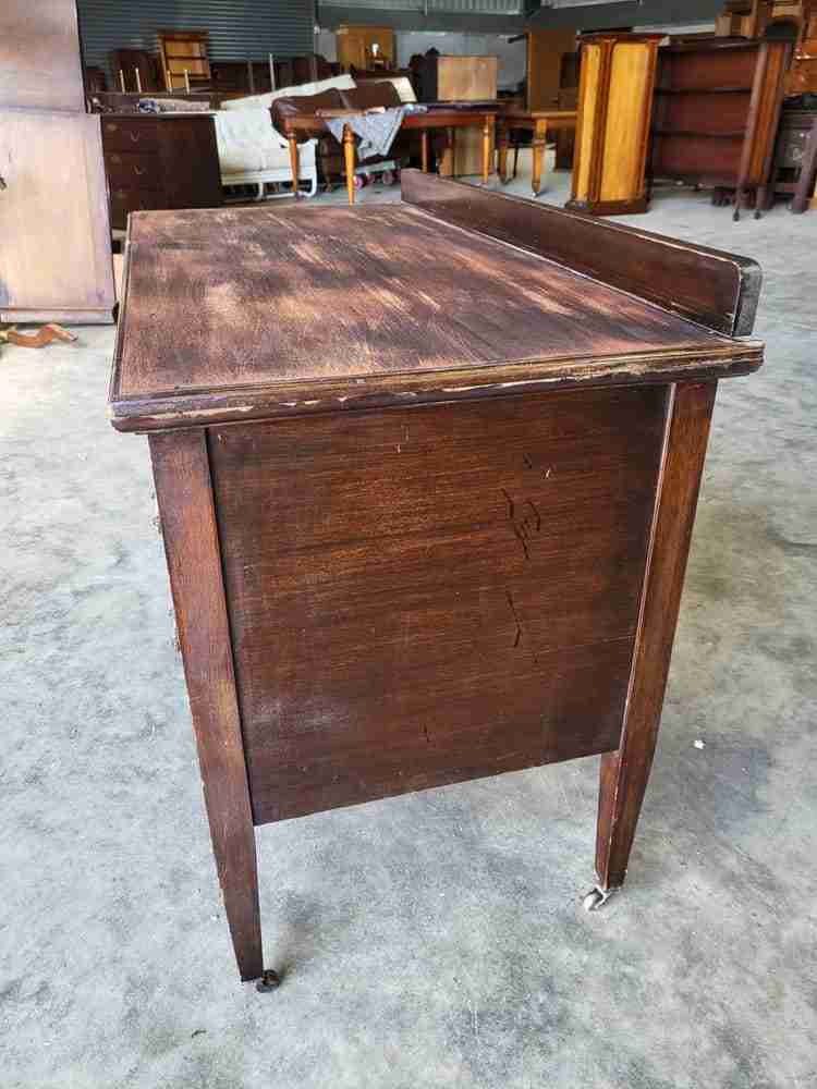 Antique Edwardian single pedestal desk 4 drawers tapered legs castors
