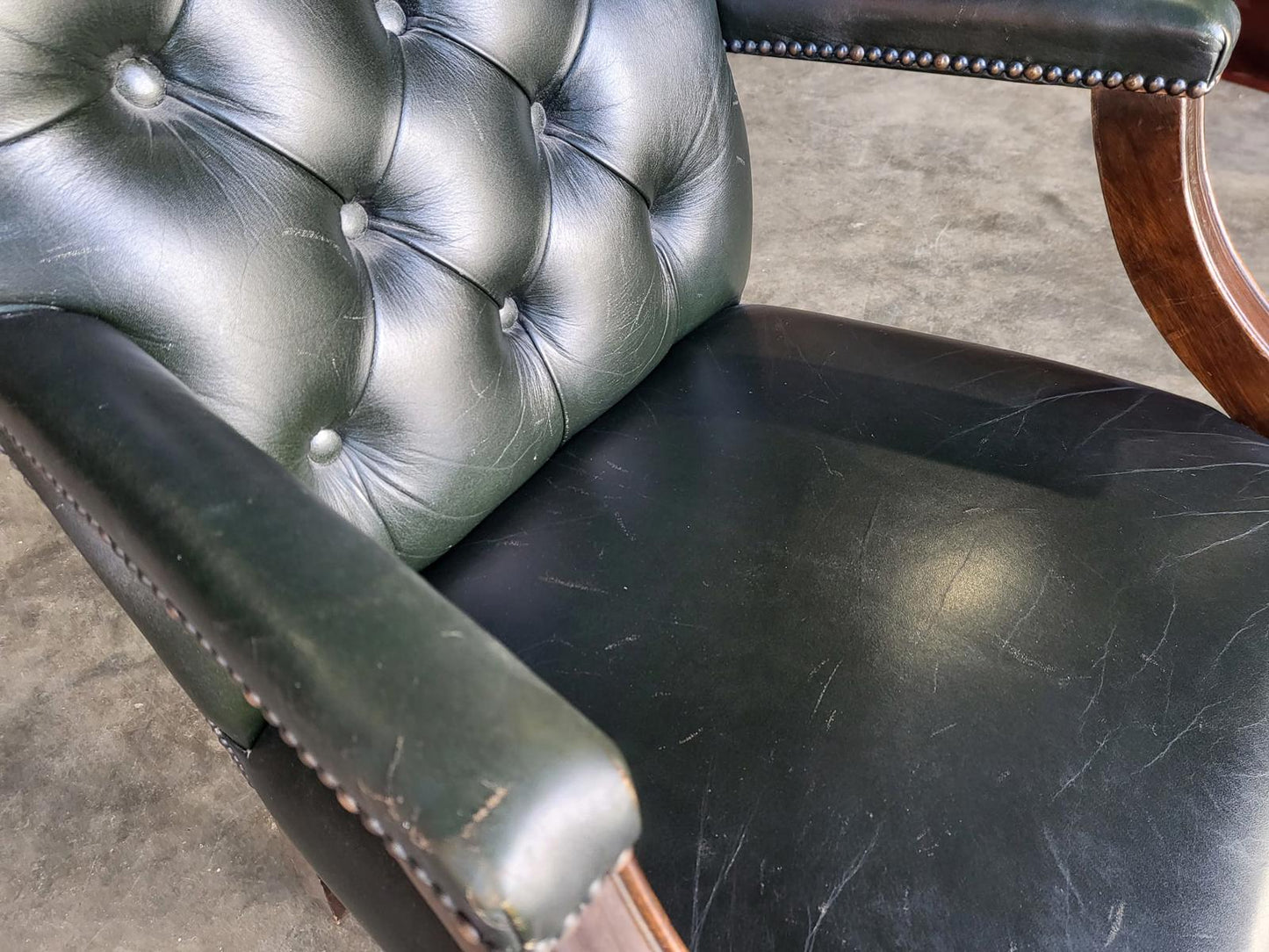 Antique repro green leather button back open armchair