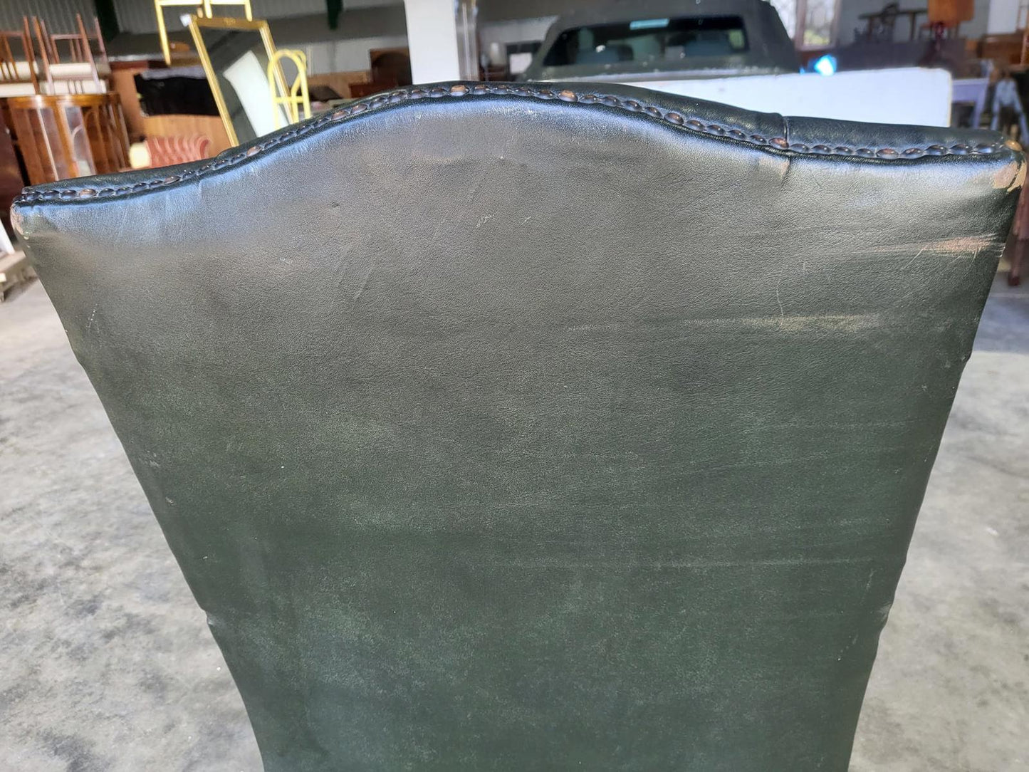 Antique repro green leather button back open armchair