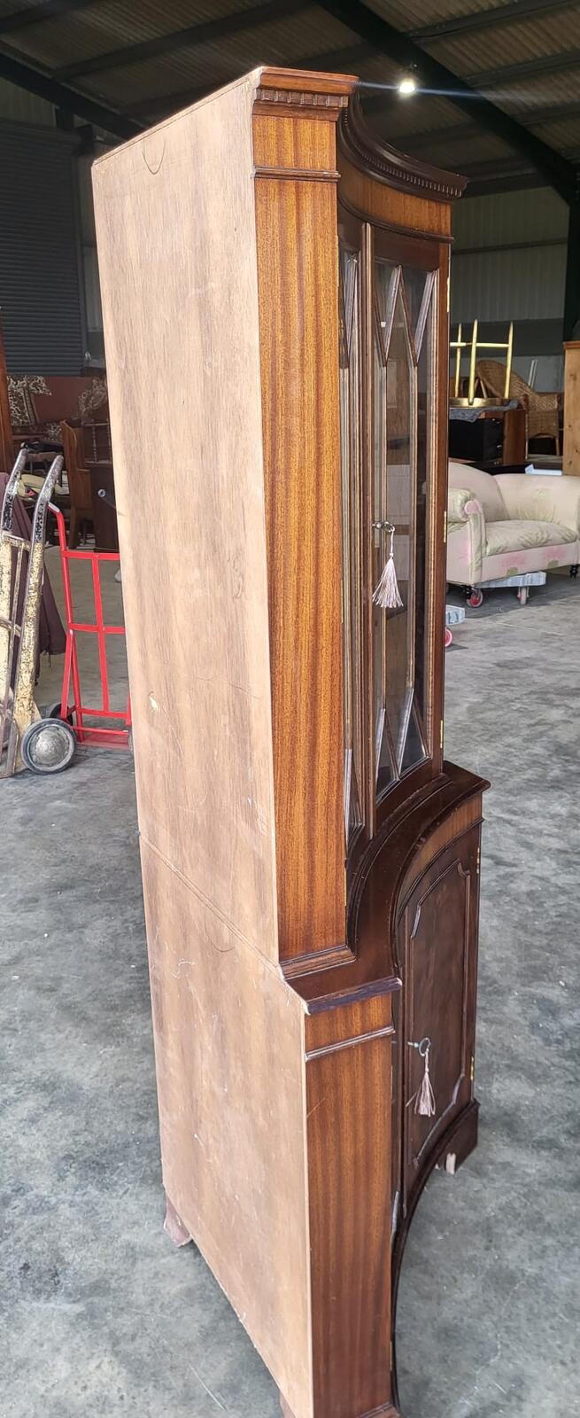 Antique repro large mahogany concave glazed corner cabinet