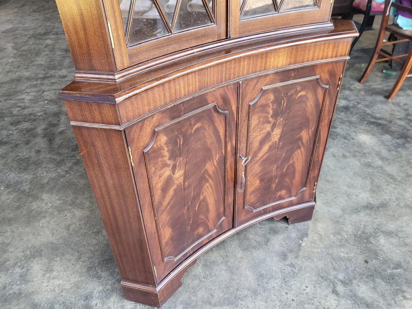 Antique repro large mahogany concave glazed corner cabinet