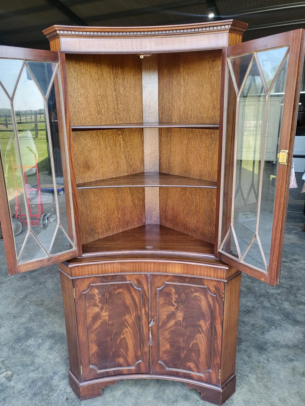 Antique repro large mahogany concave glazed corner cabinet