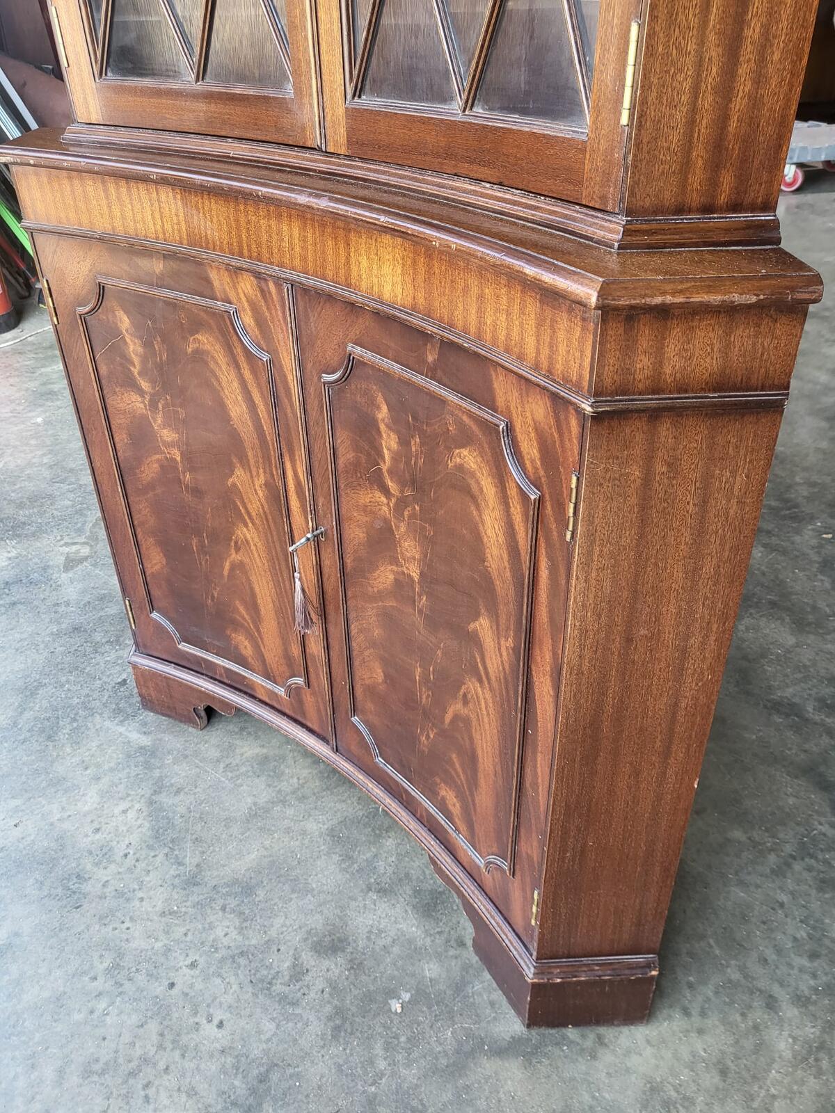 Antique repro large mahogany concave glazed corner cabinet