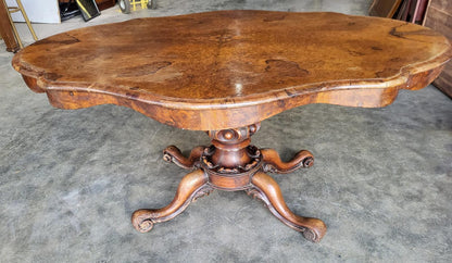 Antique Victorian walnut oval serpentine pedestal dining table