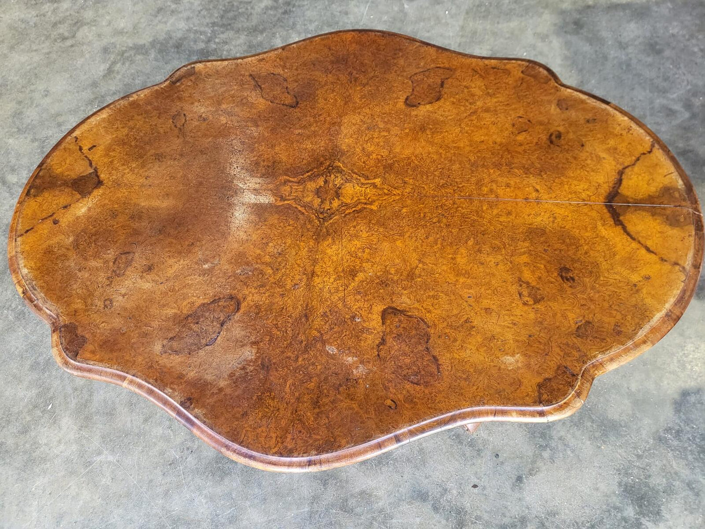 Antique Victorian walnut oval serpentine pedestal dining table