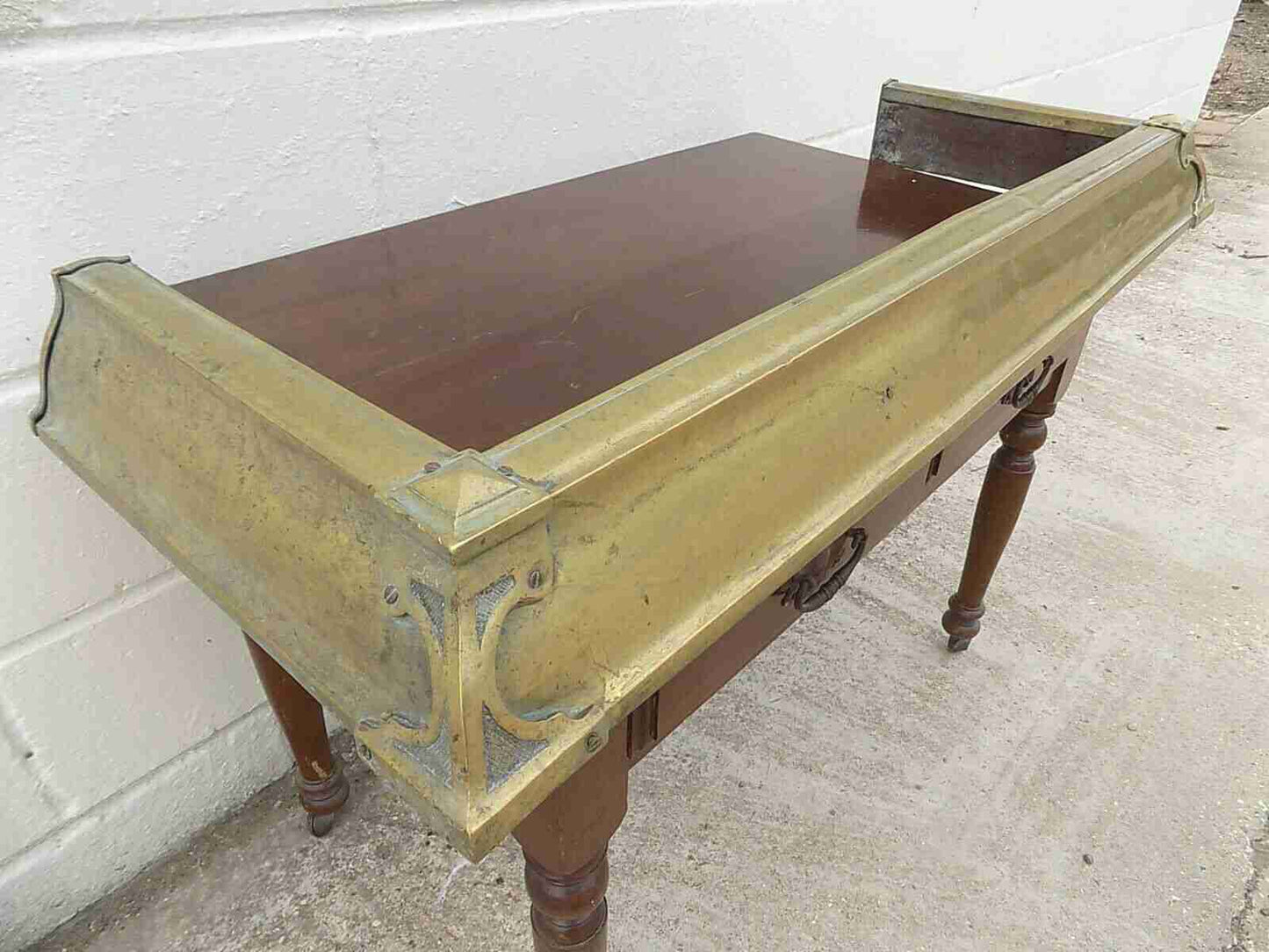 Antique fireplace fender in brass