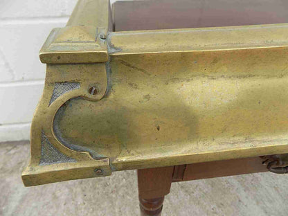 Antique fireplace fender in brass