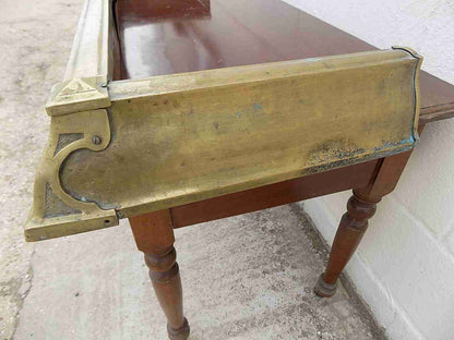 Antique fireplace fender in brass
