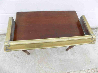 Antique fireplace fender in brass