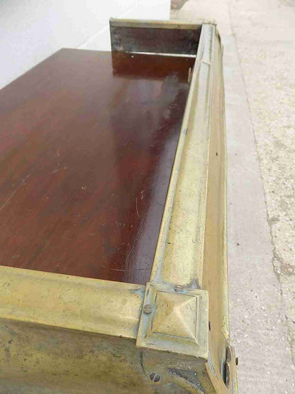 Antique fireplace fender in brass
