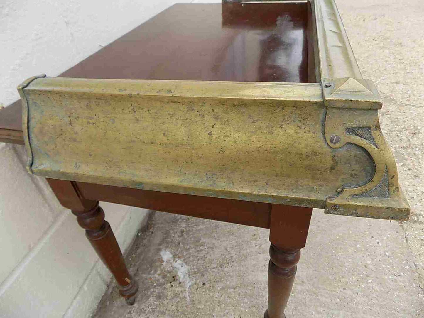 Antique fireplace fender in brass