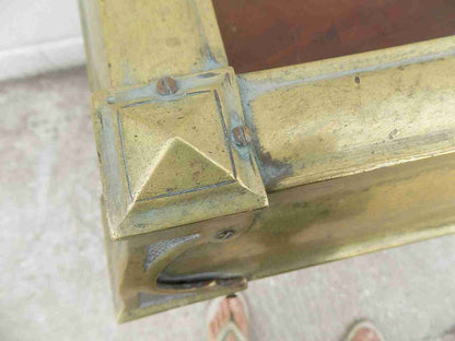 Antique fireplace fender in brass