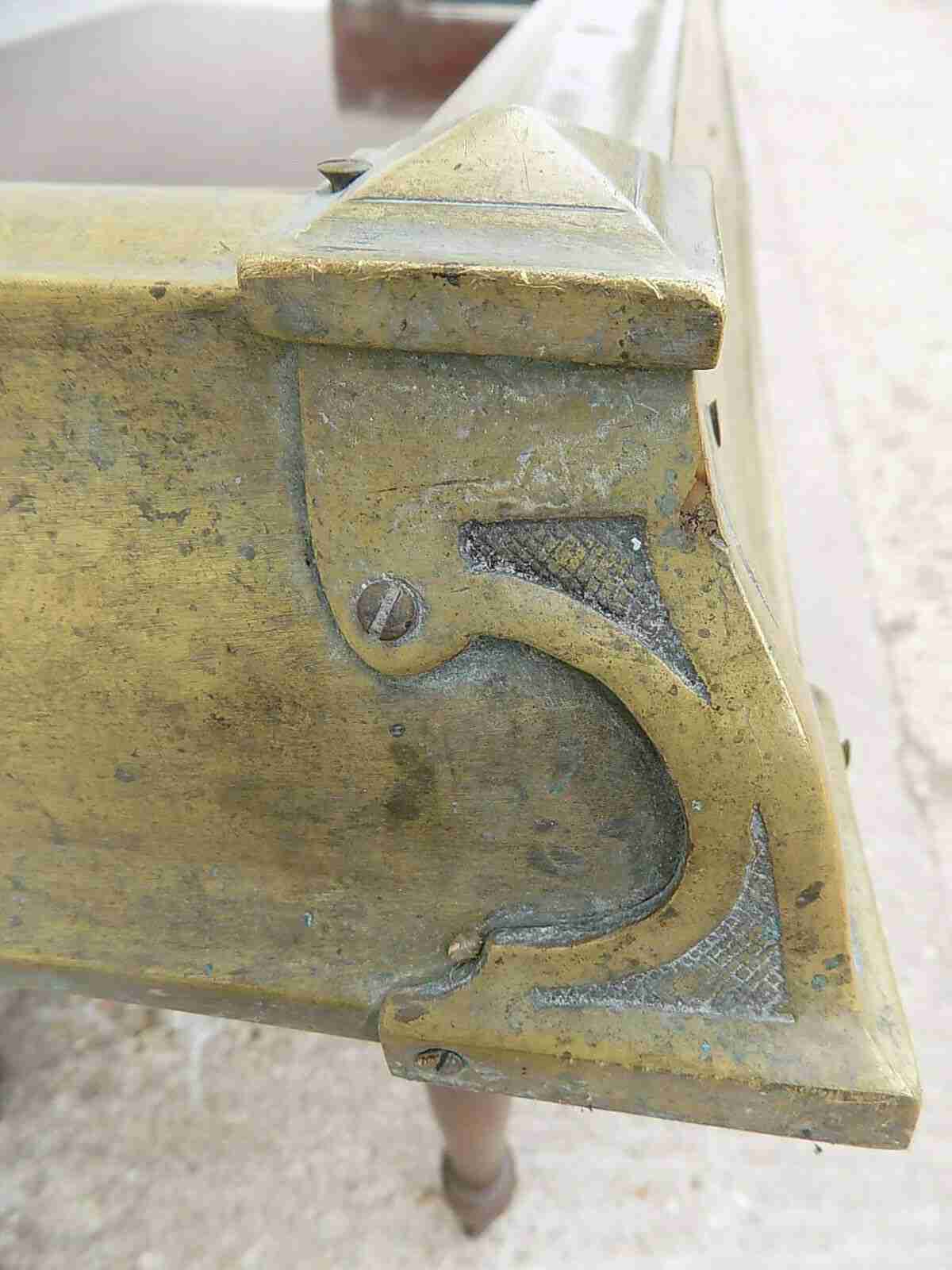Antique fireplace fender in brass