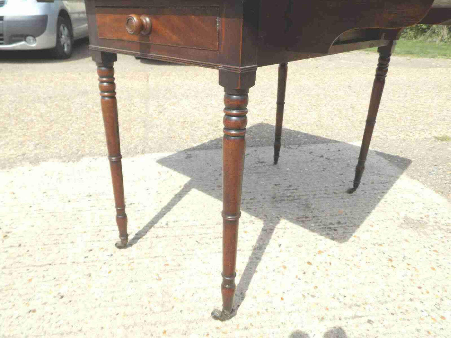 Antique Victorian mahogany extending Pembroke table with drop sides
