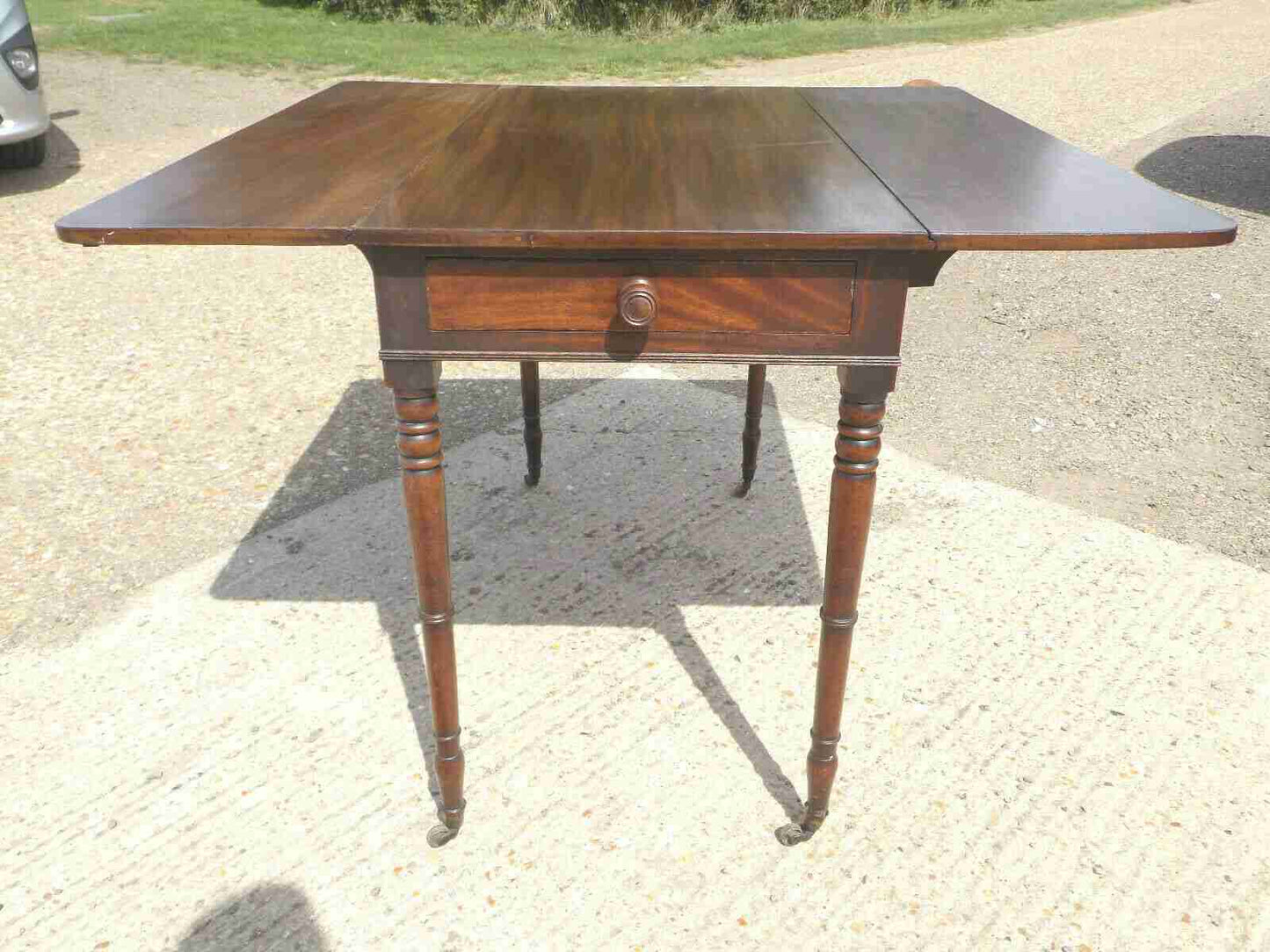 Antique Victorian mahogany extending Pembroke table with drop sides