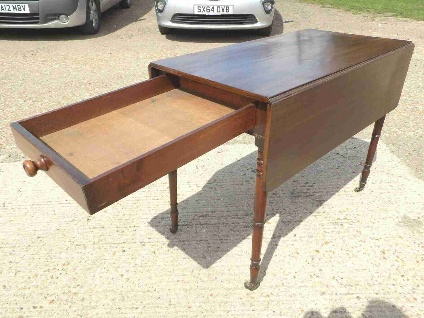 Antique Victorian mahogany extending Pembroke table with drop sides