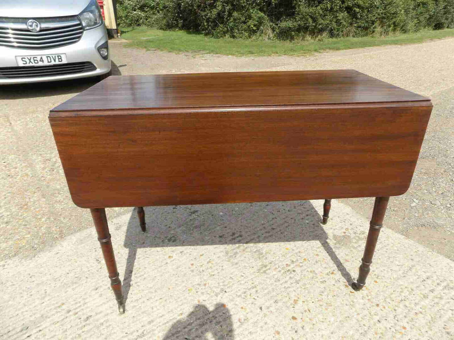 Antique Victorian mahogany extending Pembroke table with drop sides