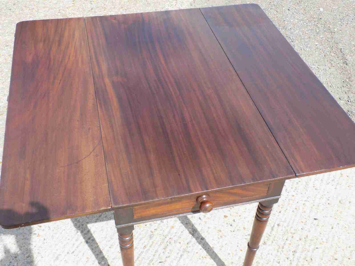 Antique Victorian mahogany extending Pembroke table with drop sides