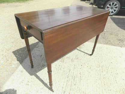 Antique Victorian mahogany extending Pembroke table with drop sides