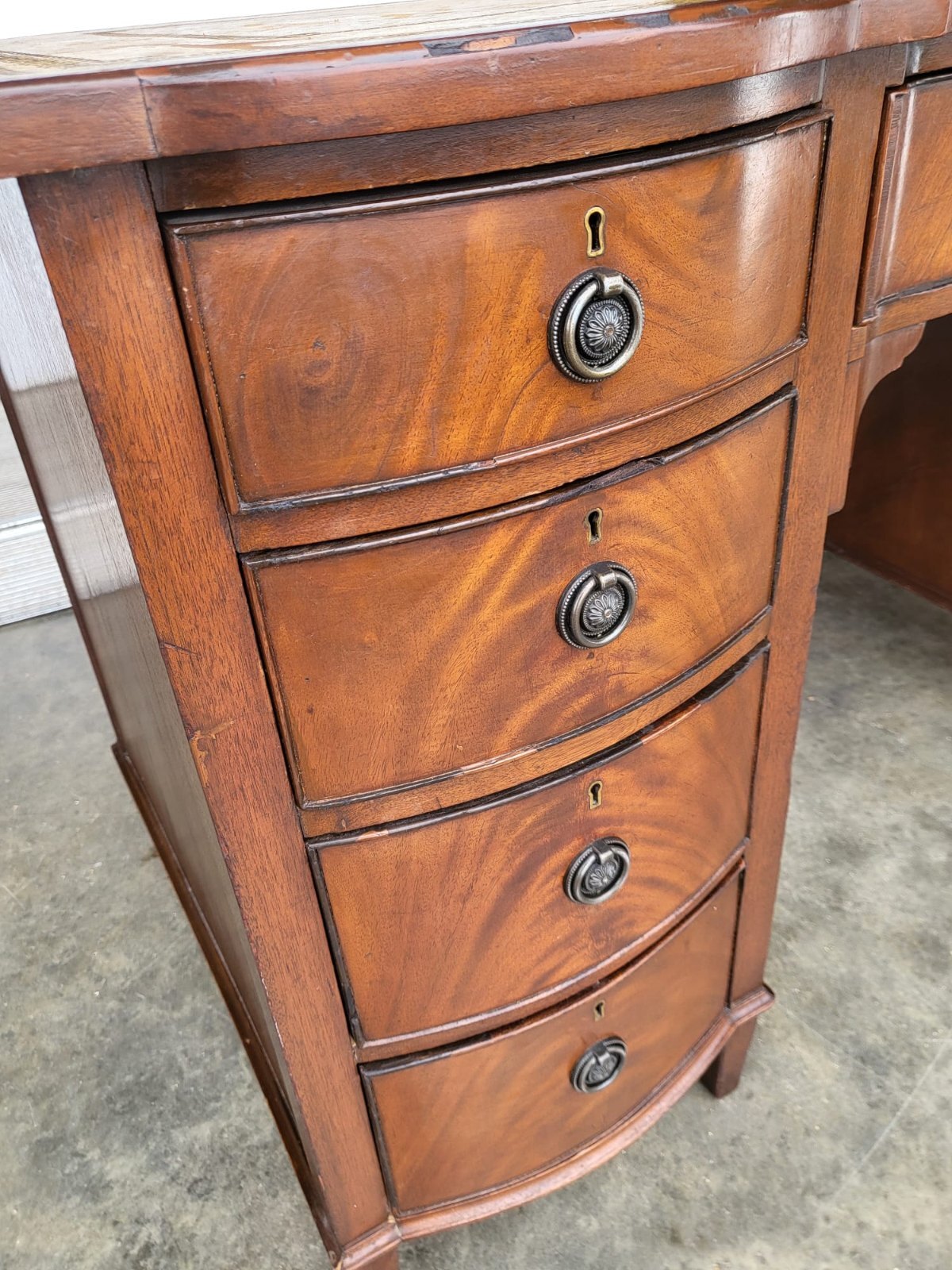 Antique repro small bow front desk 9 drawers leather top