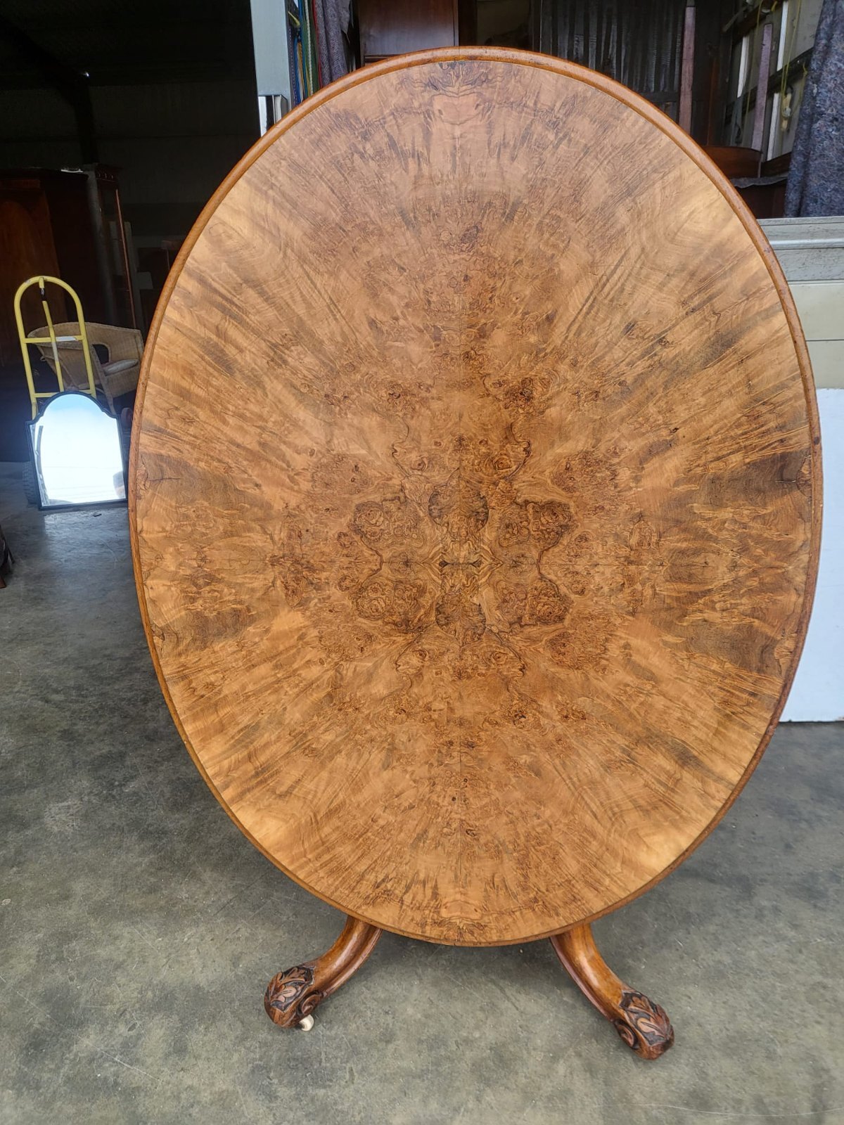 Antique Victorian oval tilt top walnut pedestal dining table seat to 6