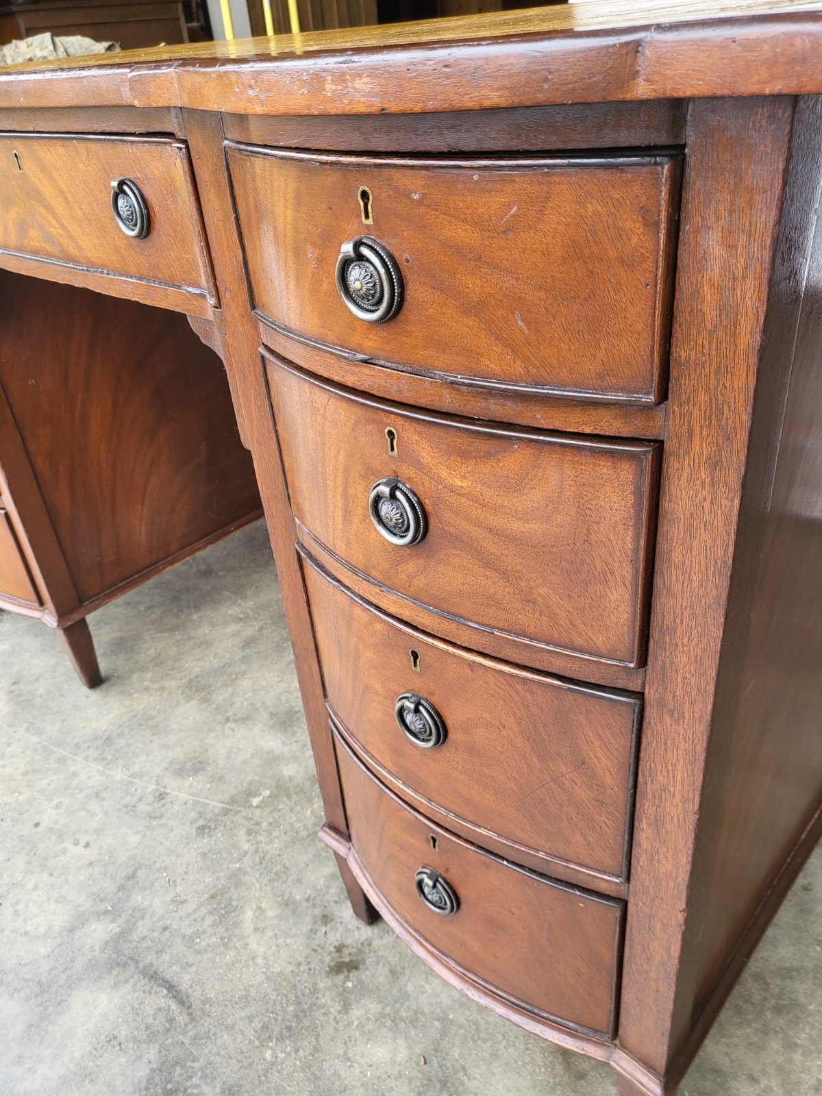 Antique repro small bow front desk 9 drawers leather top