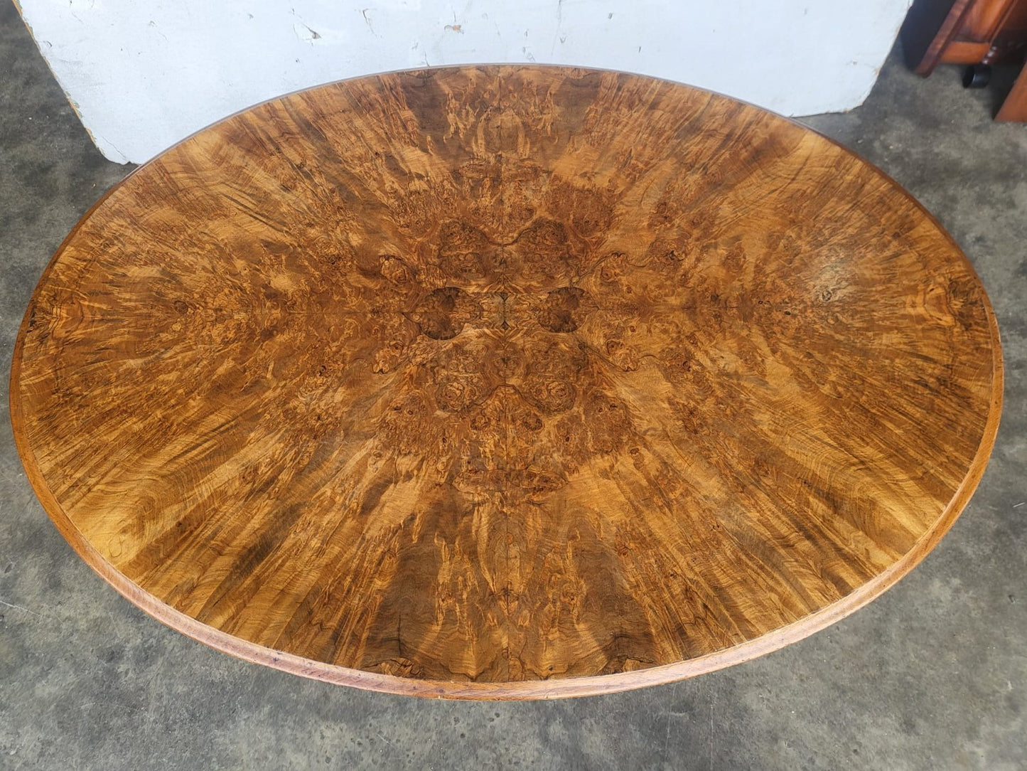 Antique Victorian oval tilt top walnut pedestal dining table seat to 6