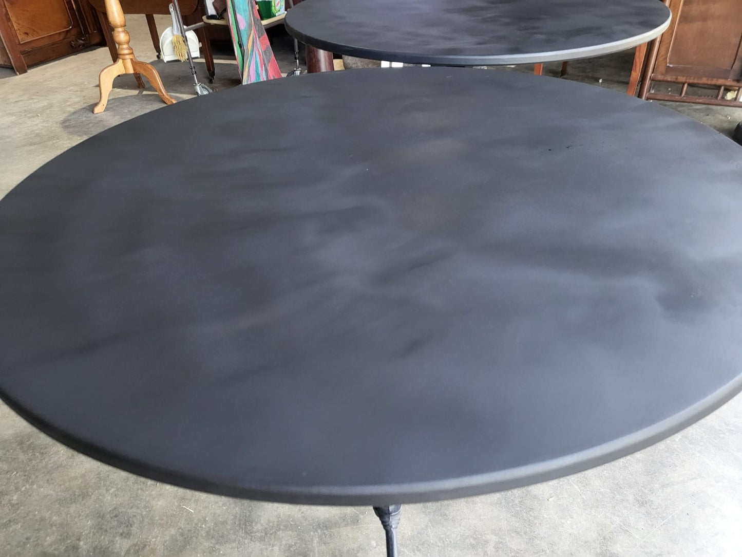 Two black round cast iron bistro dining occasional tables PRICE X 1