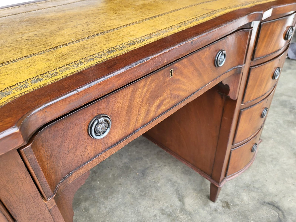 Antique repro small bow front desk 9 drawers leather top