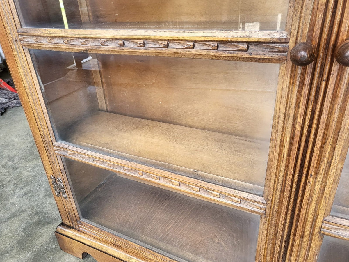 Vintage oak carved 2 door glazed low bookcase cabinet