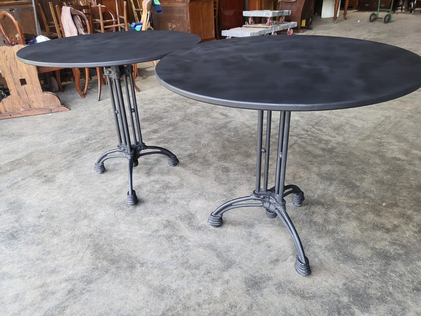 Two black round cast iron bistro dining occasional tables PRICE X 1