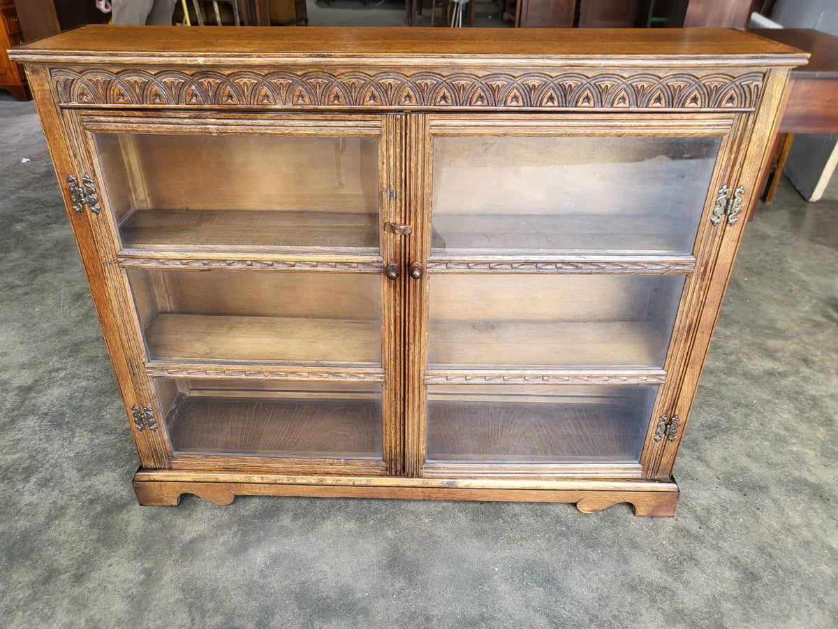 Vintage oak carved 2 door glazed low bookcase cabinet
