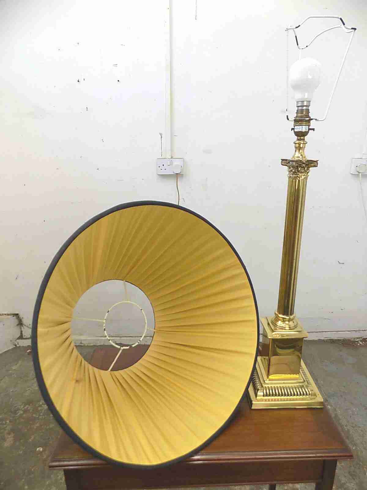 Large brass table lamp with black shade