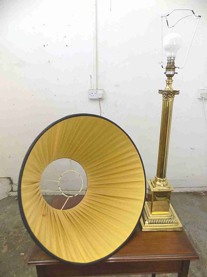 Large brass table lamp with black shade