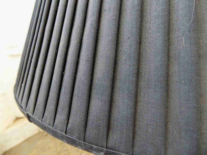 Large brass table lamp with black shade