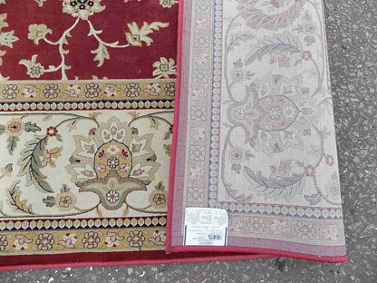 Red cream carpet with floral design