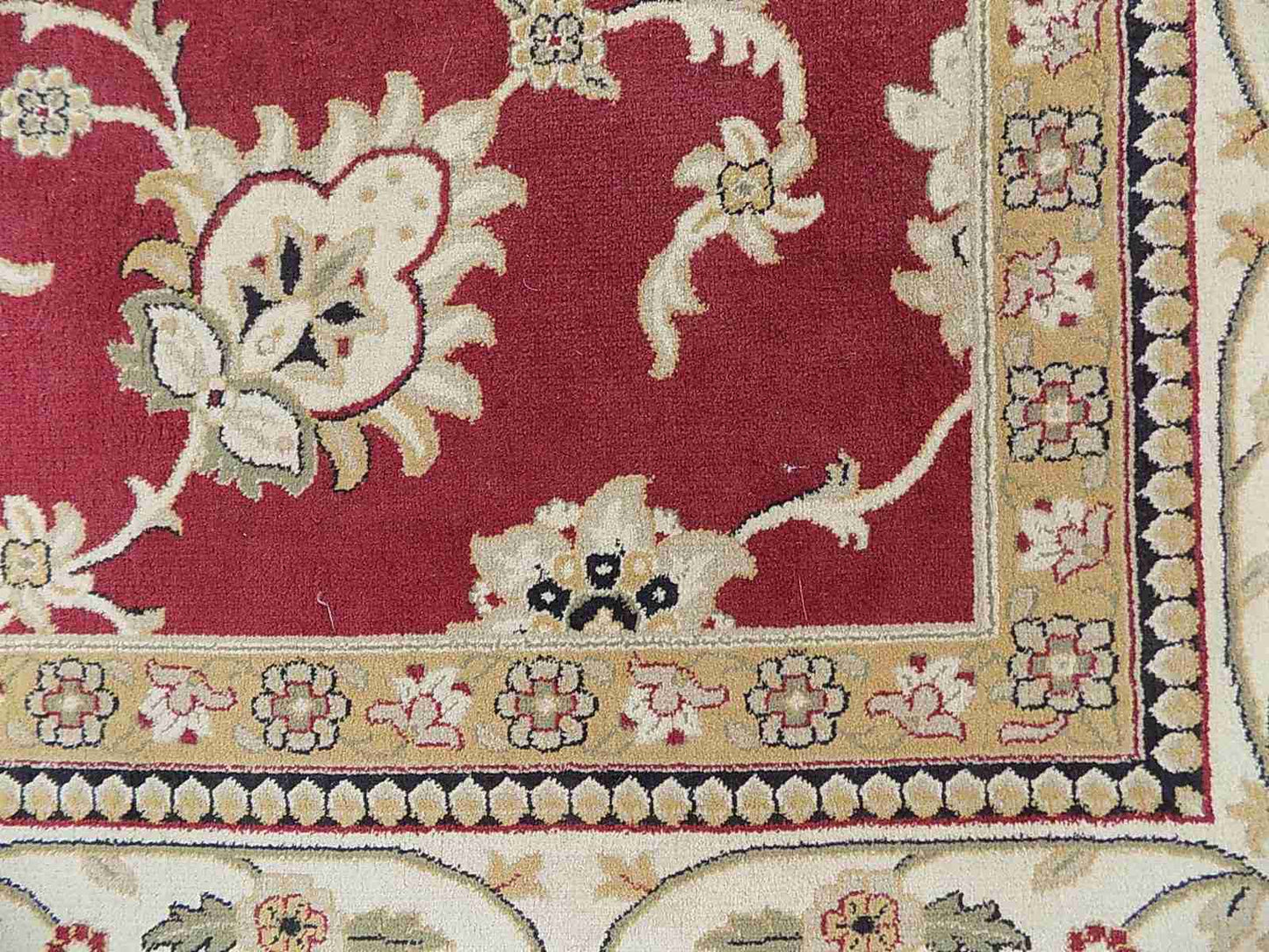 Red cream carpet with floral design
