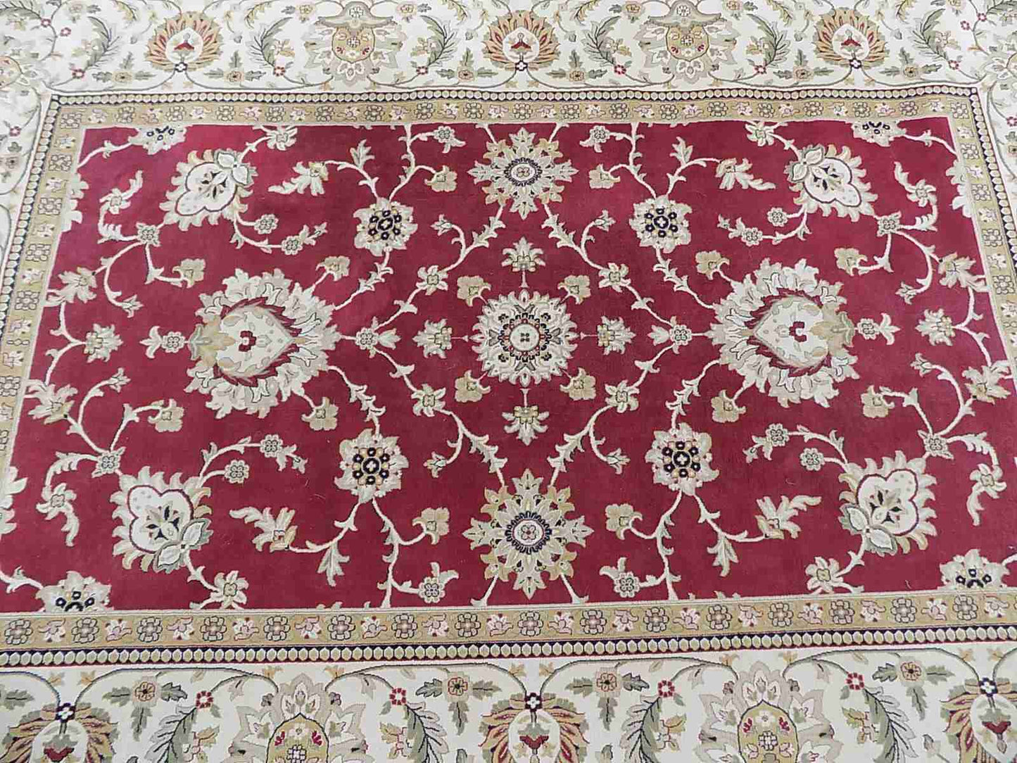 Red cream carpet with floral design